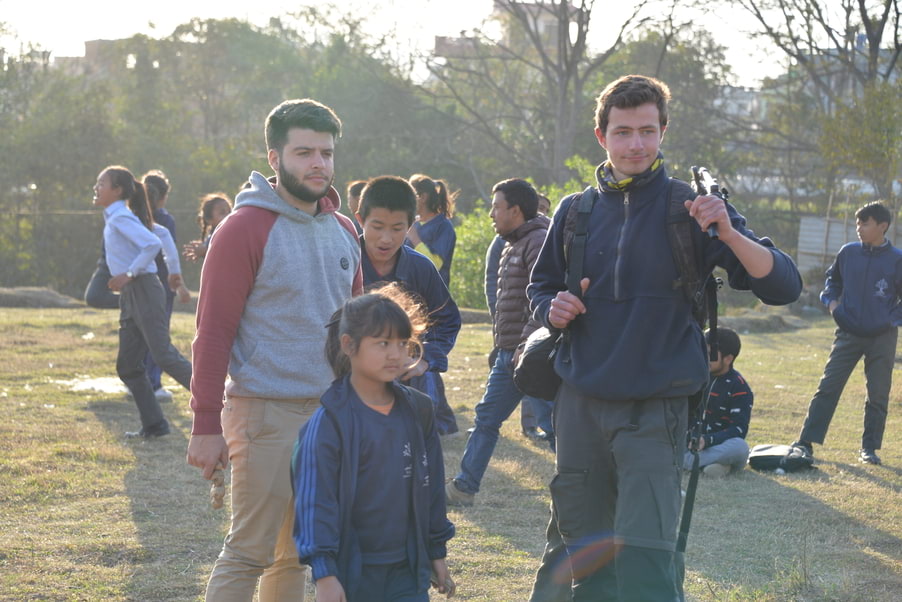 Some volunteers with some students